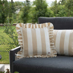 another mondaen Outdoor Kissen Ruffled Charm Beige auf Gartenlounge – beigen-weiß gestreifte Designkissen für Terrasse und Garten aus der VACANCES Outdoor Kollektion