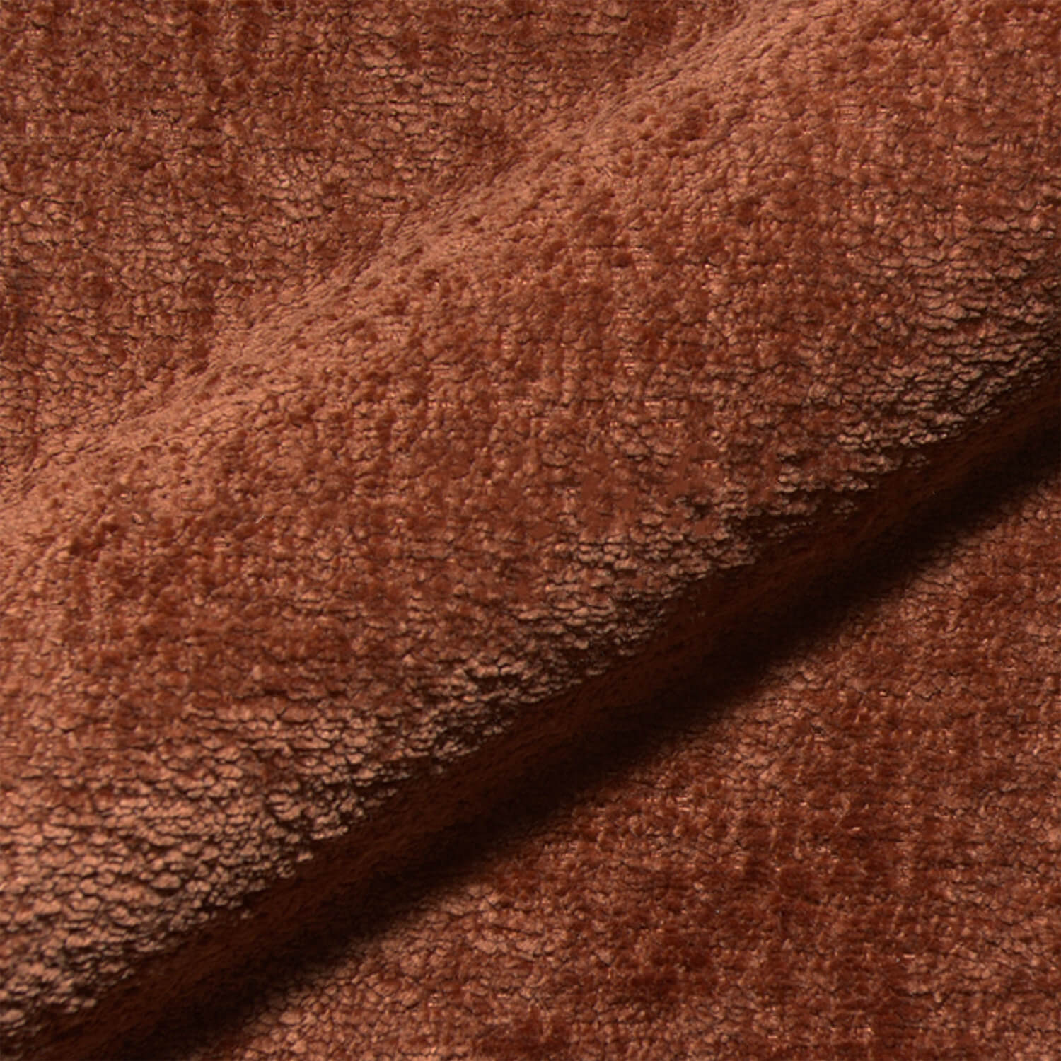 Nahaufnahme des Teddystoffs in rostrot mit dichter, weicher Struktur – hochwertiges Gewebe der Monochrom Teddy Kissen von another mondaen.